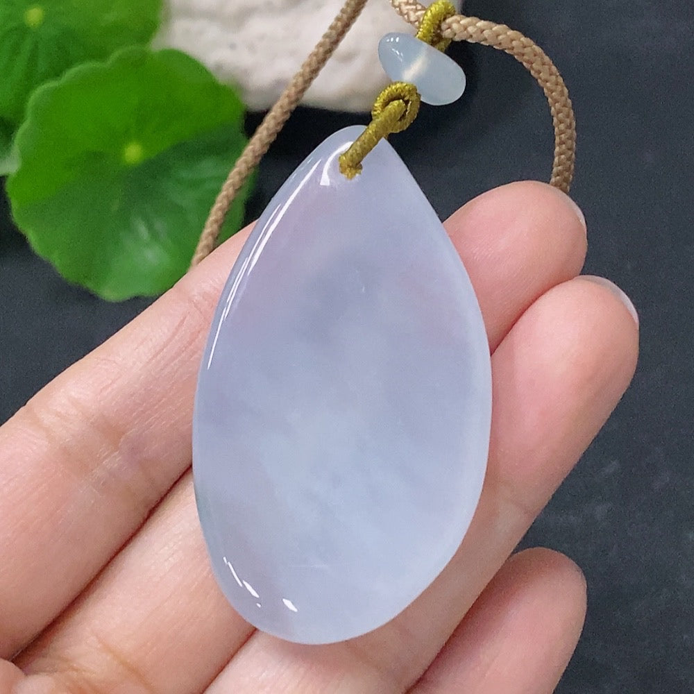 Jadeite Guanyin pendant with a formless, smooth design, crafted by HUILIU HQ, showcasing a serene Buddhist figure in jade.