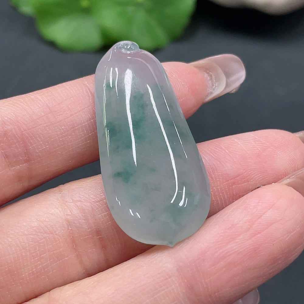 Huiliu certified jadeite Fu Gua pendant featuring a carved jade design, showcasing traditional craftsmanship and vibrant green color.