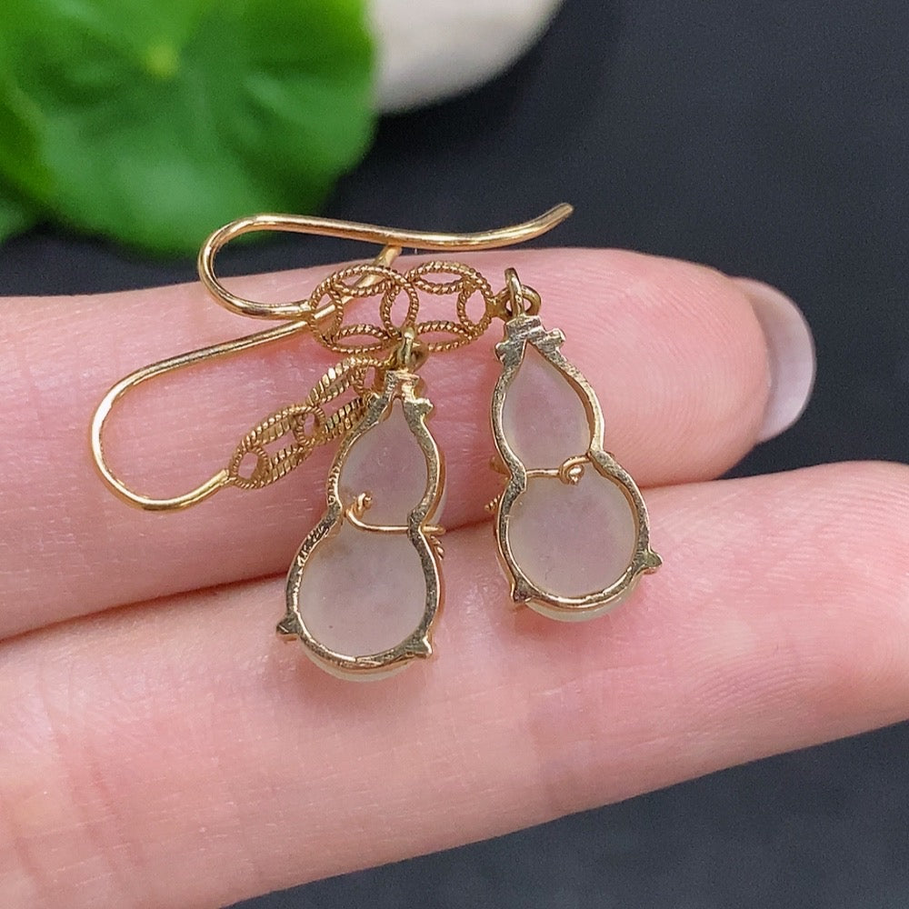 Huiliu certified jadeite gourd inlaid earrings featuring intricate craftsmanship and natural green jade coloration.