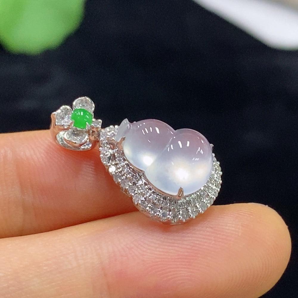 Jadeite gourd pendant inlaid with 18k gold, crafted by HUILIU HQ, featuring intricate design on smooth jade surface.