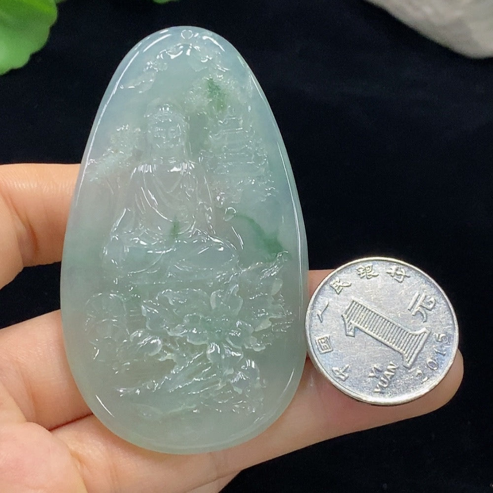 Jadeite Guanyin pendant from HUILIU HQ, intricately carved jade sculpture weighing approximately 36.45g, showcasing detailed craftsmanship.