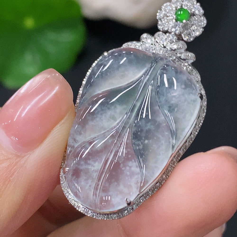 Jadeite leaf pendant with 18k gold and diamonds, featuring intricate inlay work, weighs approximately 5.7 grams.