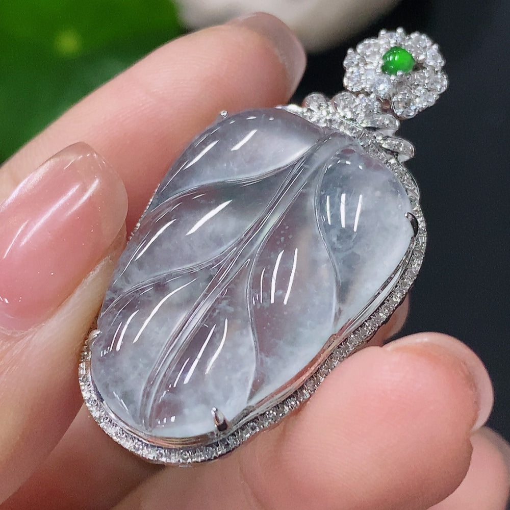 Jadeite leaf pendant with 18k gold and diamonds, HUILIU HQ, showcasing intricate inlay and elegant design, weighs approximately 5.7g.