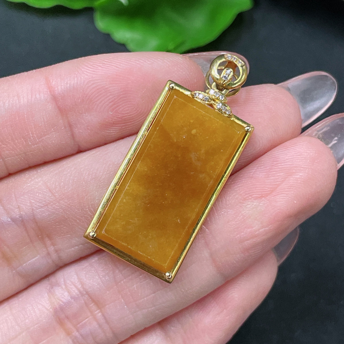 Huiliu certified jadeite inlaid piece with yellow color, natural stone with undetermined origin, showcasing intricate craftsmanship.