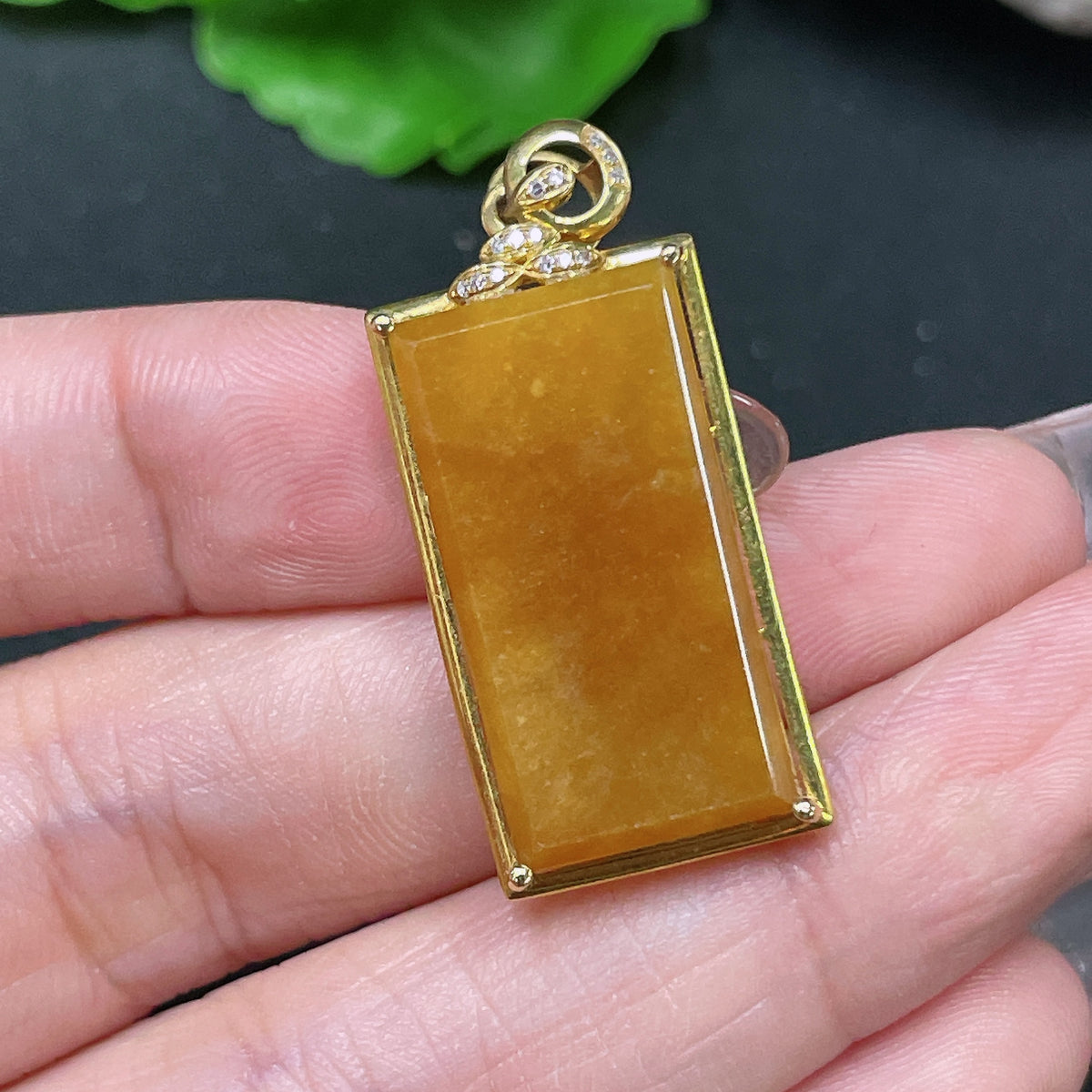Huiliu Certified jadeite inlaid piece with yellow color and undetermined origin, showcasing intricate craftsmanship and vibrant hue.
