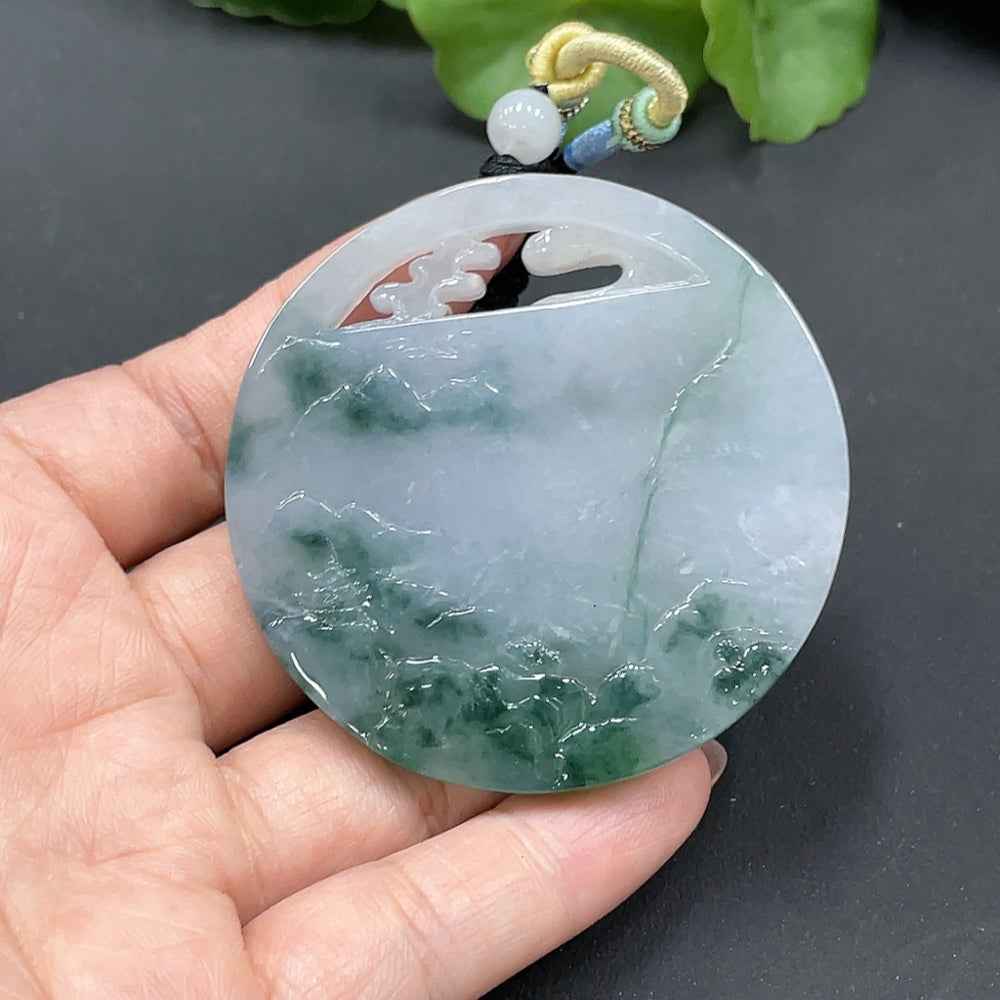 Jadeite landscape pendant from HUILIU HQ, showcasing detailed green jade artwork, weighs 52.048 grams.