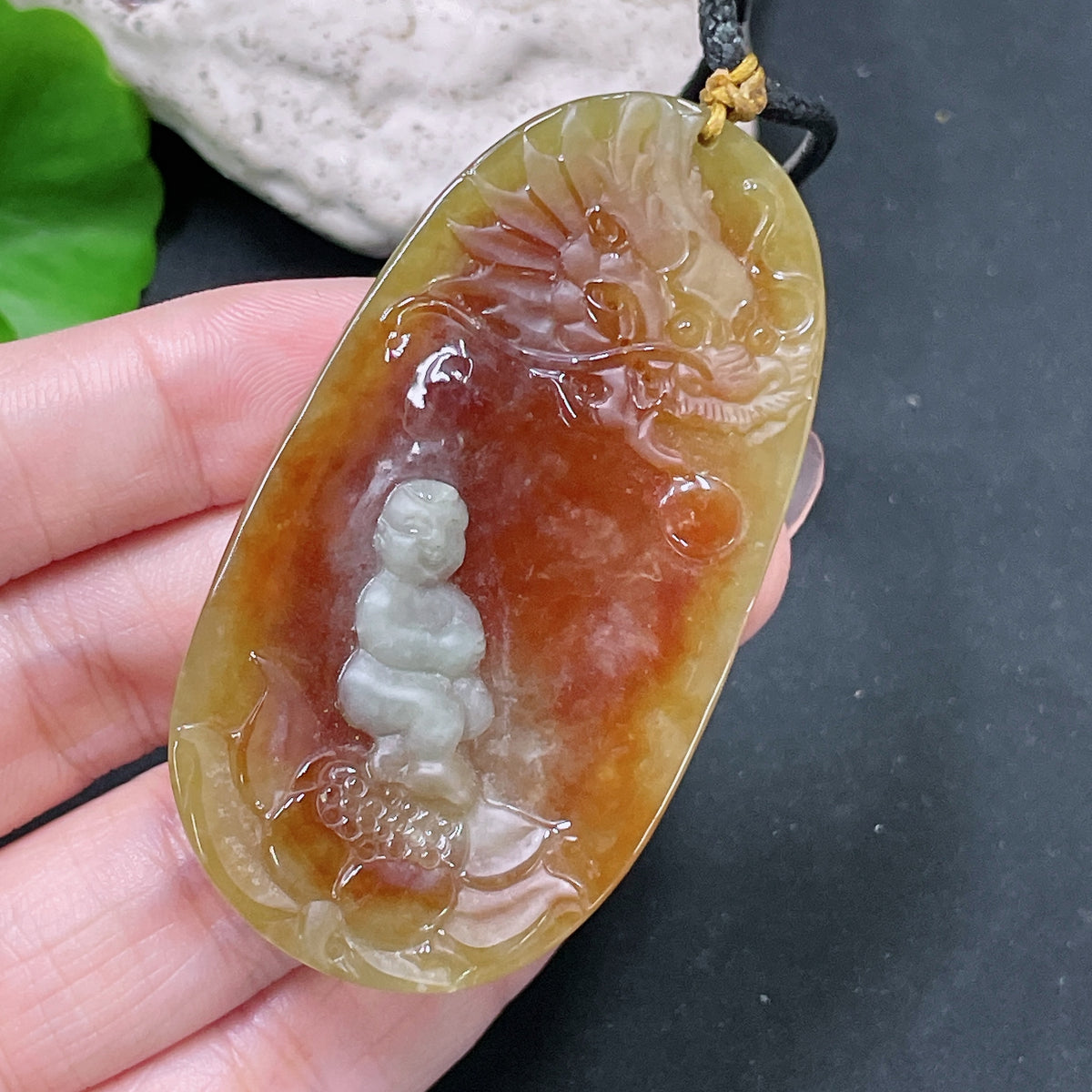 HUILIU HQ jadeite Lotus pendant weighing approx. 36.65g with yellow-colored details, featuring a rope for wearing.