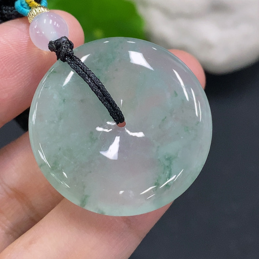 HUILIU HQ jadeite peace knot pendant with rope, approximately 12.5g, featuring a polished green jade charm and intricate knot design.