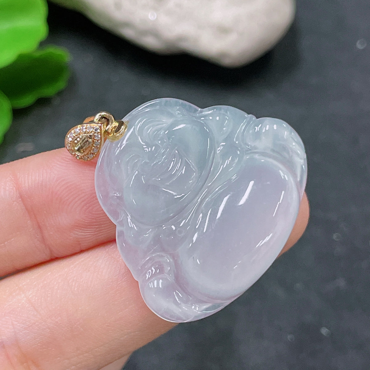 Jadeite pendant featuring Buddha design with 18K gold bail and diamond accent, crafted by HUILIU HQ.
