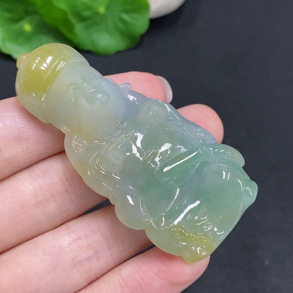 Huiliu HQ jadeite pendant in yellow color with undetermined origin, showcasing smooth polished surface and natural jade appearance.