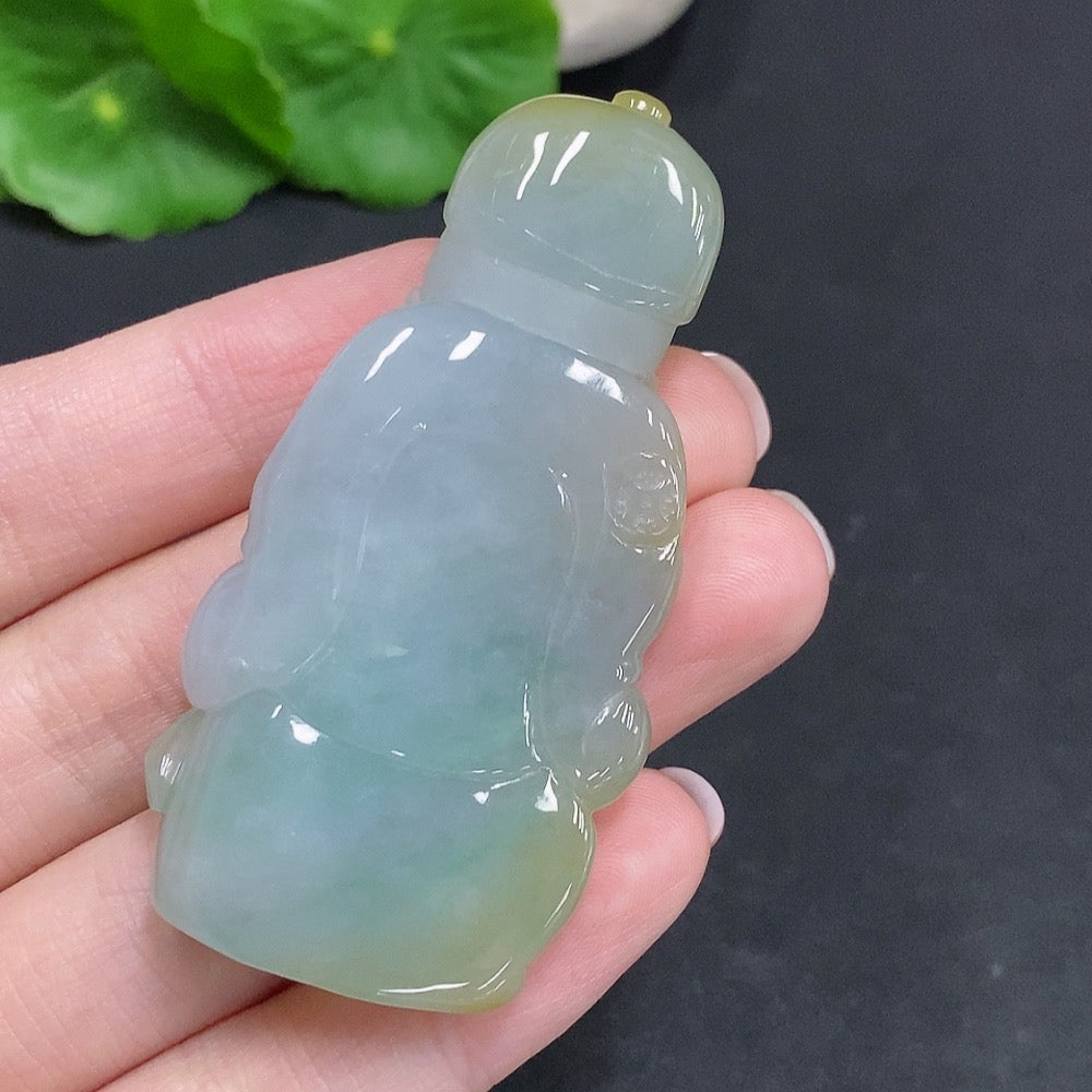 Yellow jadeite pendant from HUILIU HQ with undetermined origin, showcasing a polished jade stone with a smooth surface.