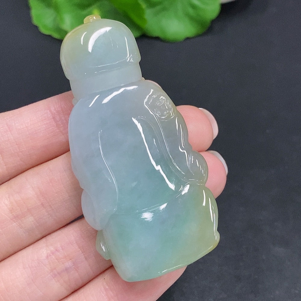 Huiliu Certified yellow jadeite pendant with undetermined origin, showcasing its smooth, polished surface and natural color.