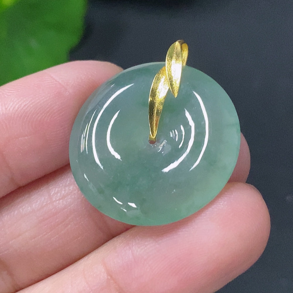 Huiliu Jadeite Peace Knot Pendant in 18K gold showing a detailed jadeite pendant with a smooth, polished finish and intricate knot design