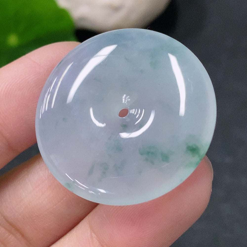 HUILIU HQ jadeite pendant peace ring showing a detailed jade ring with a smooth, polished surface and intricate design.