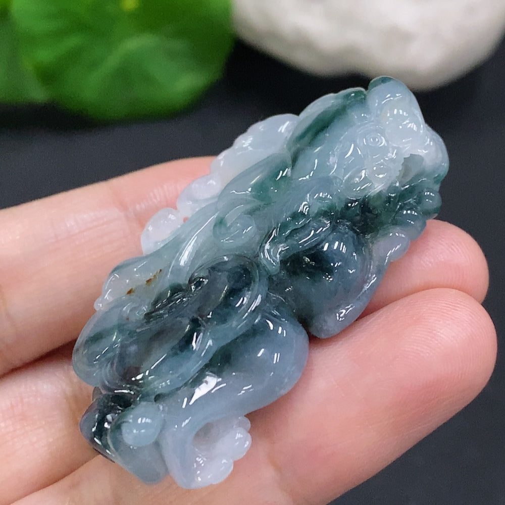 Huiliu certified jadeite Pi Xiu pendant featuring intricate carving, traditional Chinese design, and green jade color.