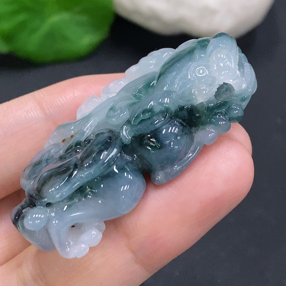 Huiliu Certified Jadeite Pi Xiu pendant featuring intricate carving, showcasing traditional jade craftsmanship and vibrant green color.