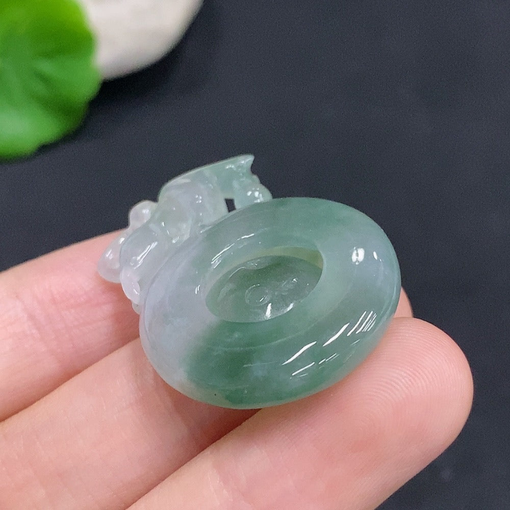 Huiliu certified jadeite Reversal of Fortune pendant featuring intricate carved design on smooth green jade jewelry.