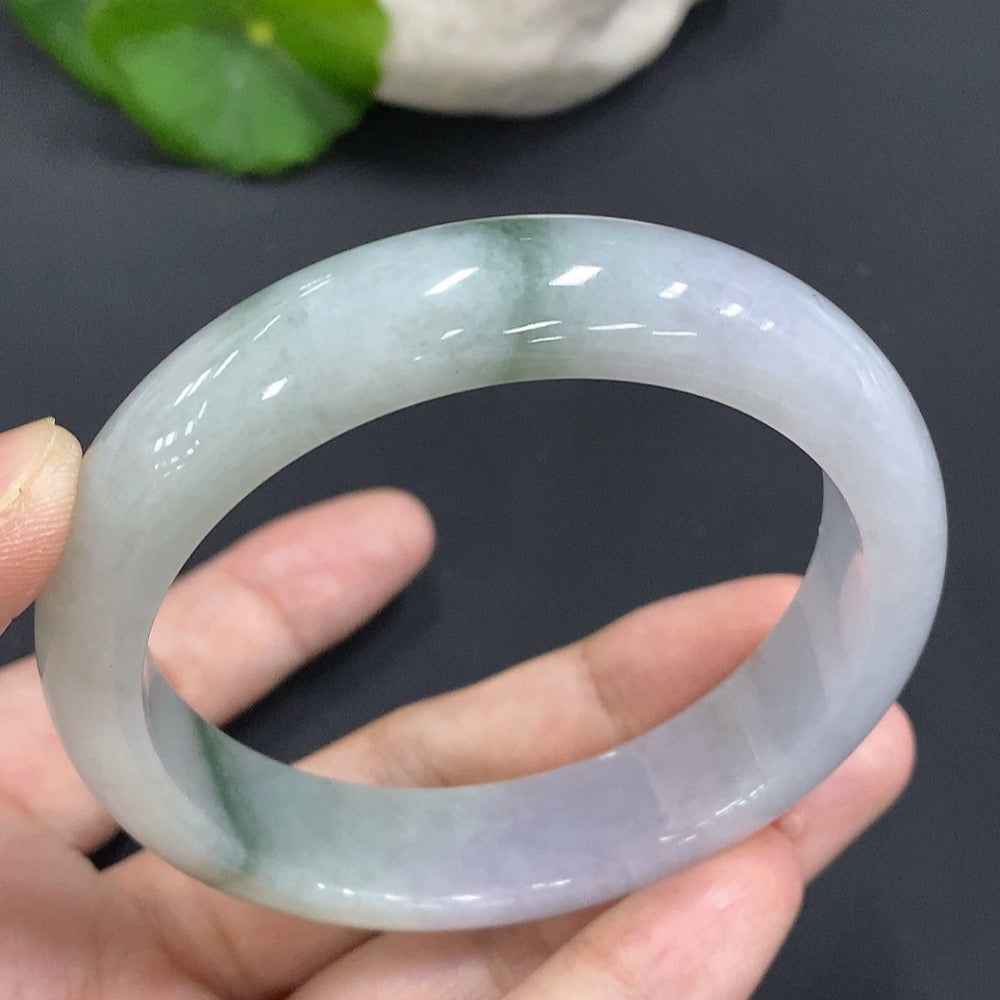 Huiliu Certified Jadeite Round Bangle showcasing smooth, polished green jade with subtle natural variations and a glossy finish.