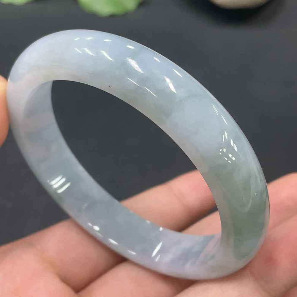 Huiliu Certified Jadeite Round Bangle featuring smooth, polished jade surface and elegant design on a white background.