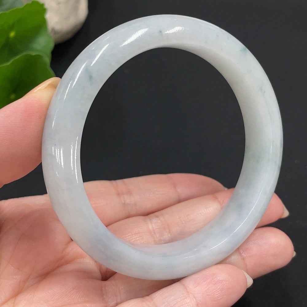 Huiliu HQ jadeite round bangle, handcrafted jade jewelry with Huiliu certification, showcasing smooth, polished green jade.