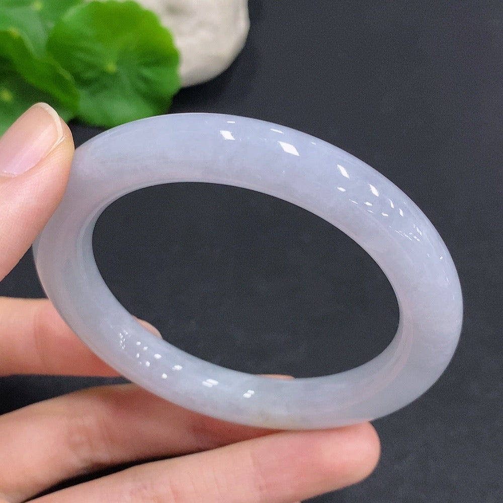 Huiliu Certified Jadeite round bangle showcasing smooth, polished green jade with a glossy finish and elegant circular shape.