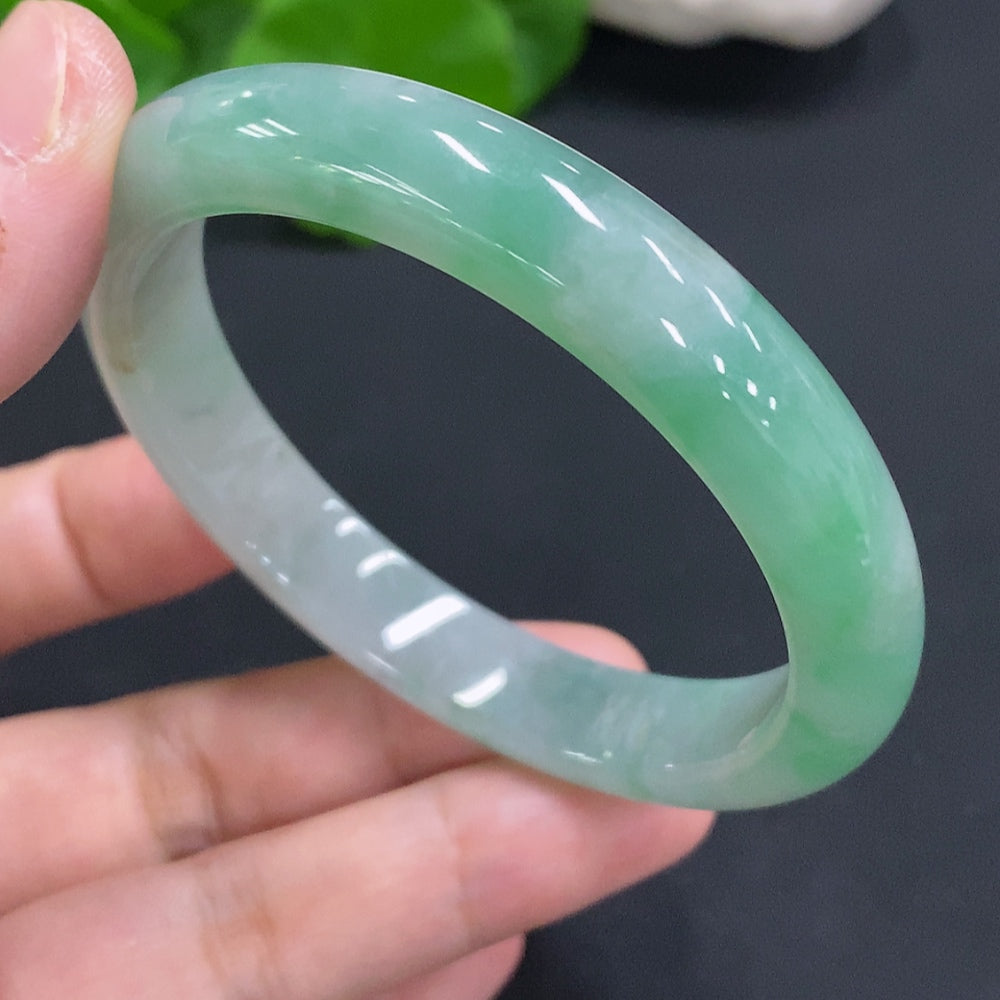 HUILIU HQ jadeite round bangle in size 55.6 with a total weight of 42.3g, showcasing smooth, polished jadeite surface.