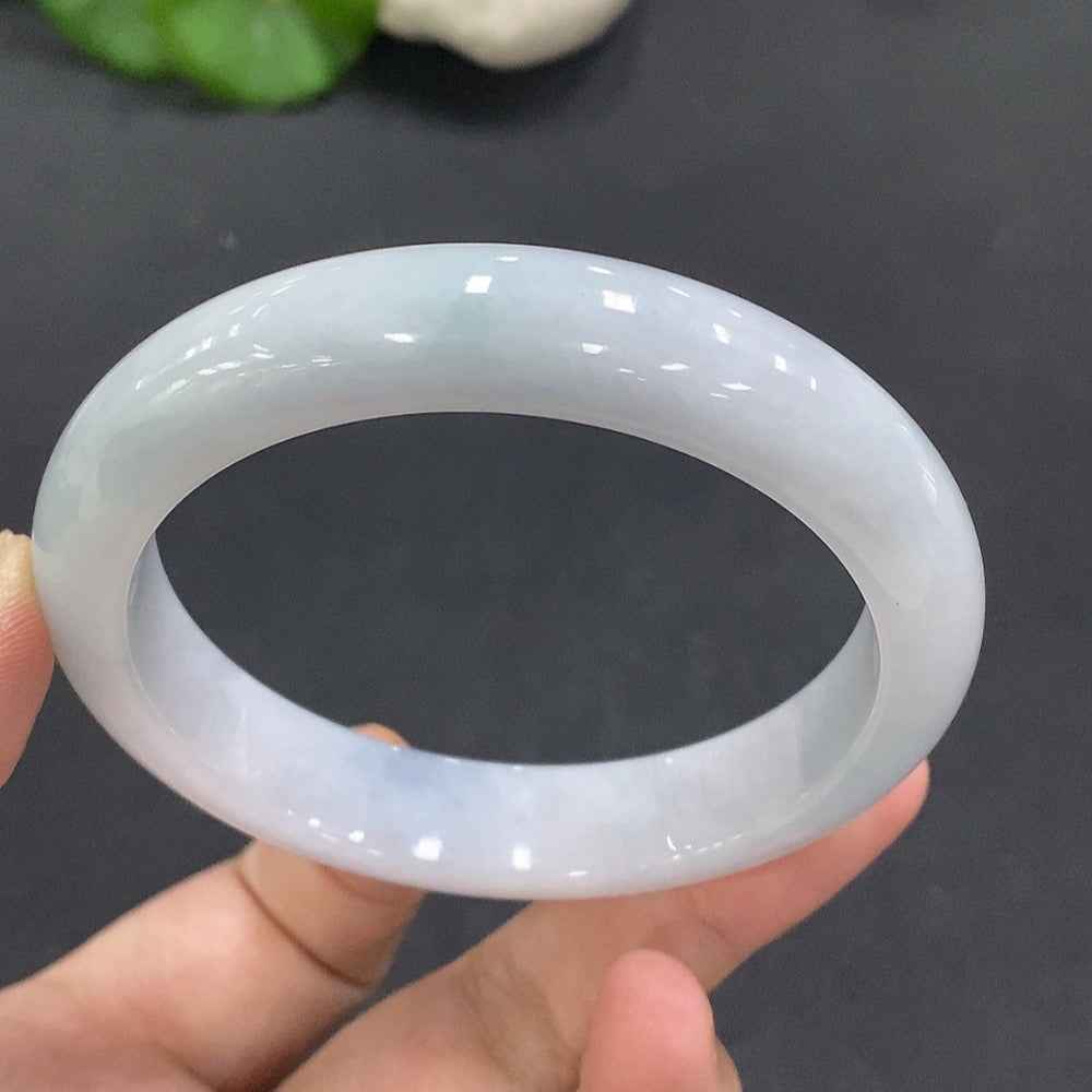 HUILIU HQ jadeite round bangle in size 56, weighing 52.823g, showcasing smooth, polished jadeite with a vibrant green hue.