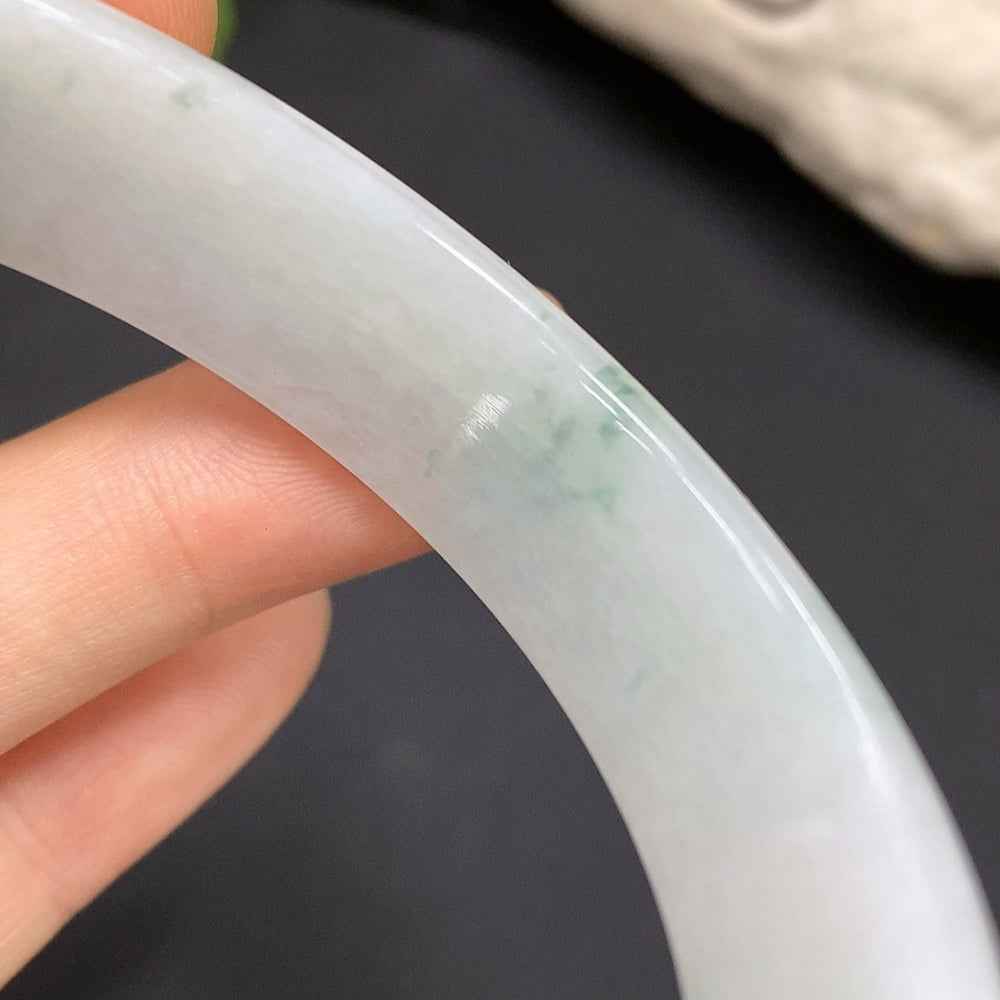 Huiliu Certified Jadeite round bracelet showcasing smooth, polished jade beads on a delicate string, natural green hue.