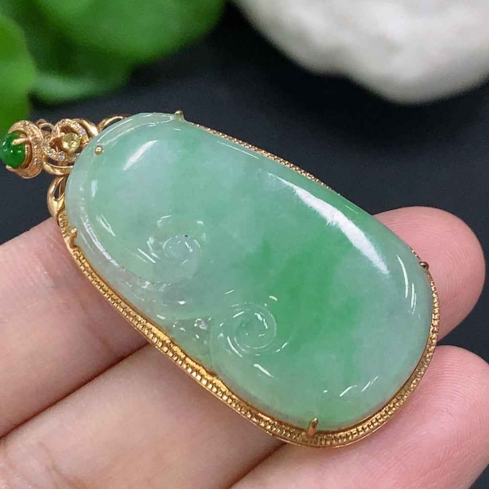 Huiliu certified jadeite Ruyi pendant with intricate inlaid design, showcasing smooth, polished jade in a detailed carved shape.