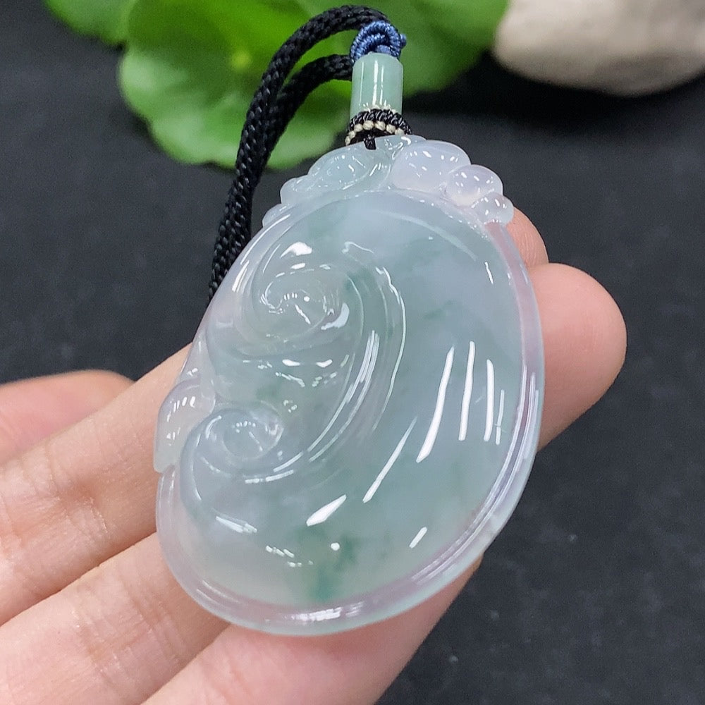 Jadeite Ruyi pendant from HUILIU HQ, featuring a polished jade design with a cord, weighing approximately 16.7 grams.