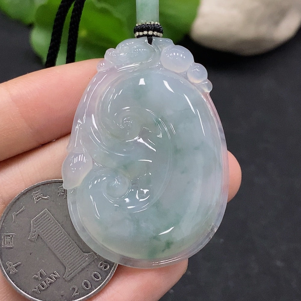 HUILIU HQ jadeite Ruyi pendant with carved design, weighing approximately 16.7g including cord, showcasing smooth green jade craftsmanship.