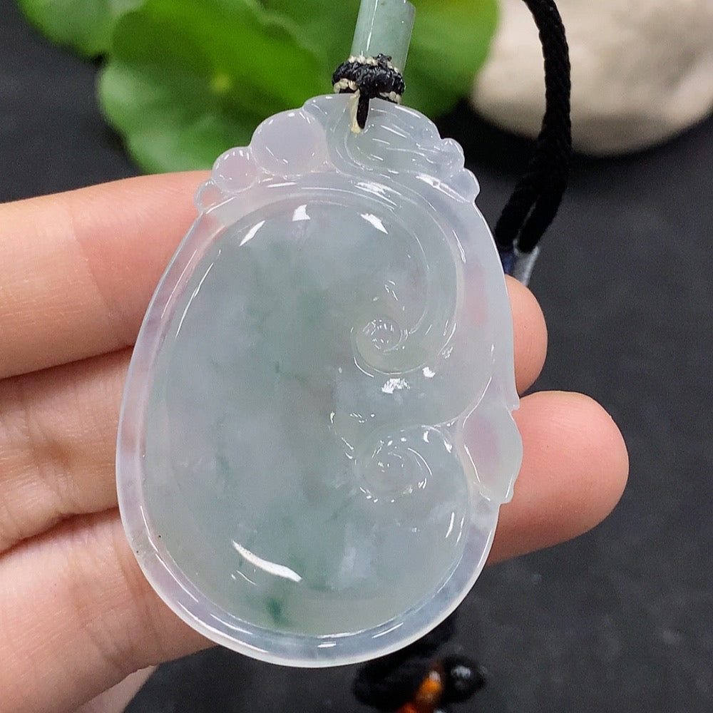 HUILIU HQ jadeite Ruyi pendant with natural green jade, weighing approximately 16.7g including cord, displayed against a neutral background.
