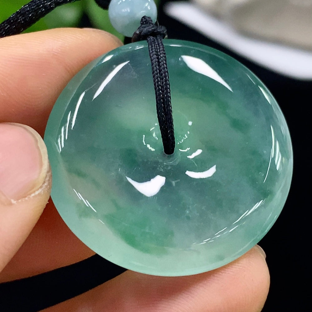 HUILIU HQ jadeite safety buckle pendant with rope, weighs approximately 17.67g, showcasing smooth green jade and intricate design.