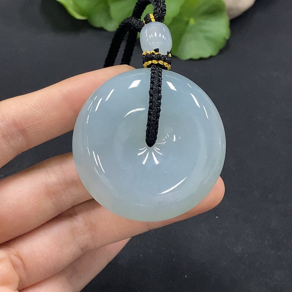HUILIU HQ Jadeite safety buckle pendant showing smooth green jade with a safety clasp, weighs approximately 57.49 grams.