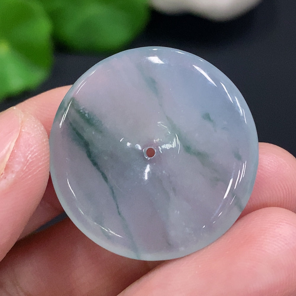 Jadeite safety buckle from HUILIU HQ, handcrafted jade piece weighing approximately 7.6g with smooth, polished surface and natural green hue.