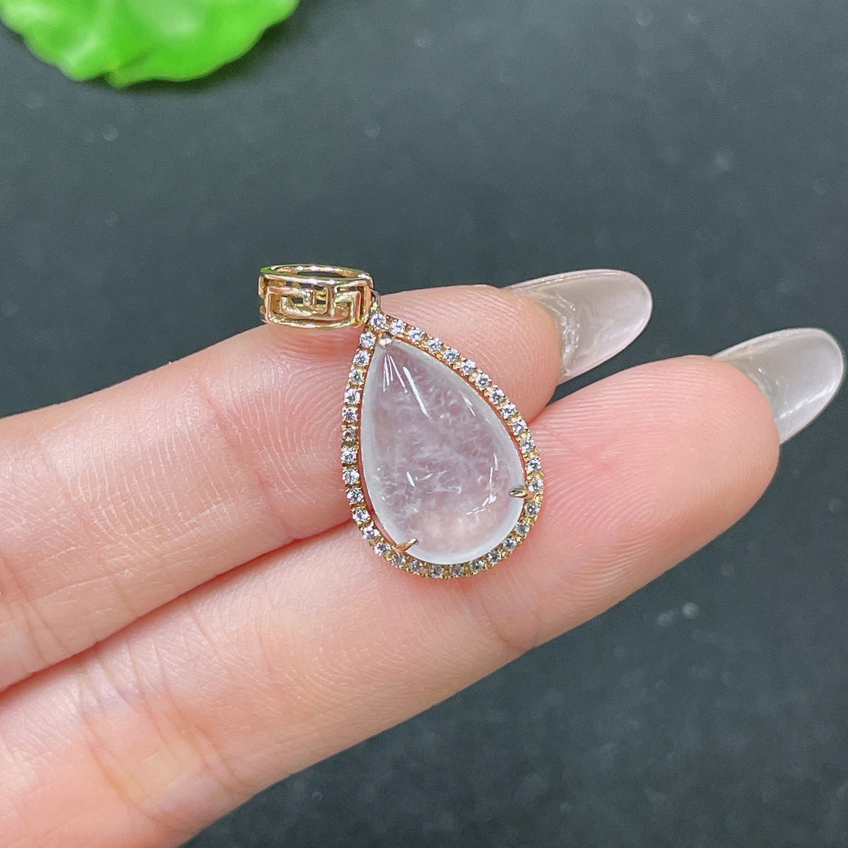 Huiliu Jadeite teardrop inlay pendant showcasing smooth jade surface and elegant design, certified non-diamond jade jewelry.