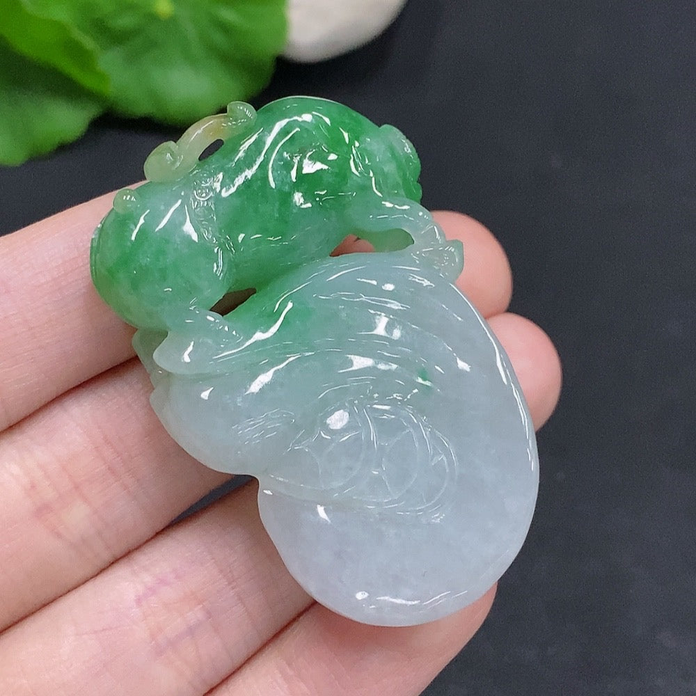 Huiliu Jadeite Turn the Tide Pendant featuring a polished jade pendant with carved ocean wave design, certified by HUILIU HQ.