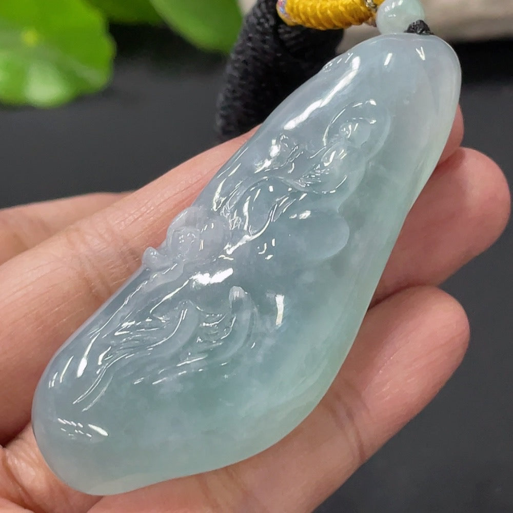 Jadeite Enlightenment Pendant by HUILIU HQ featuring a smooth, polished jade gemstone pendant with intricate carving details.