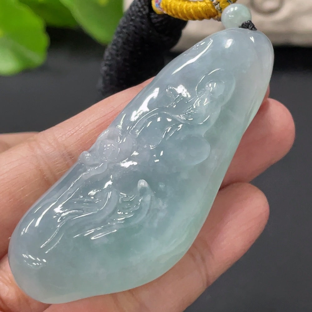 HUILIU HQ Jadeite Enlightenment Pendant showcasing a polished jade pendant with intricate carvings and natural green hues.