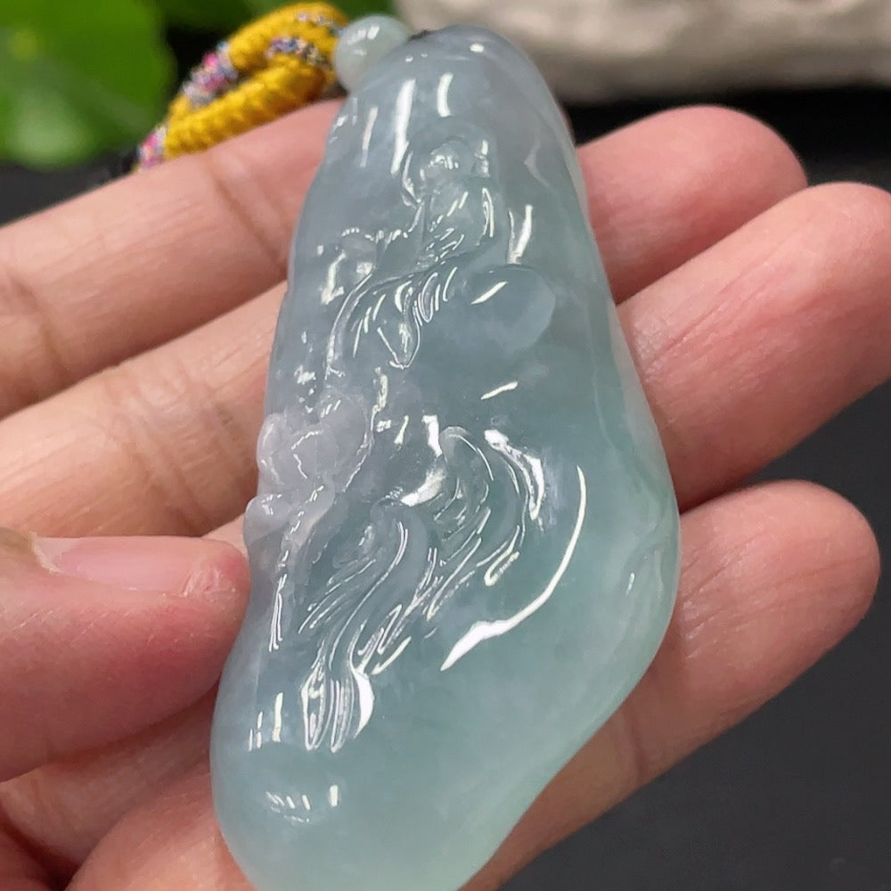 HUILIU HQ Jadeite Enlightenment Pendant featuring a smooth, polished green jade pendant with intricate carvings and a silver bail.