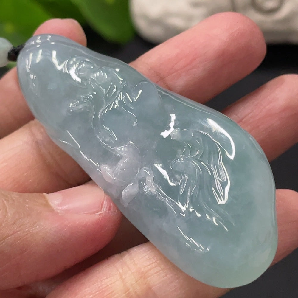 HUILIU HQ Jadeite Enlightenment Pendant featuring a polished green jade gemstone with intricate carving details.