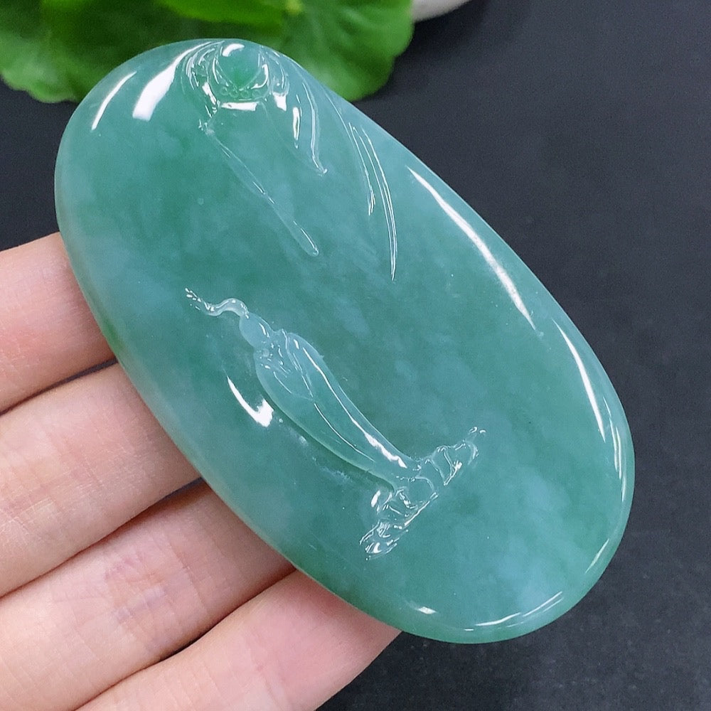 Jadeite Guanyin pendant with a formless design, crafted by HUILIU HQ, showcasing smooth jadeite material and intricate carving.