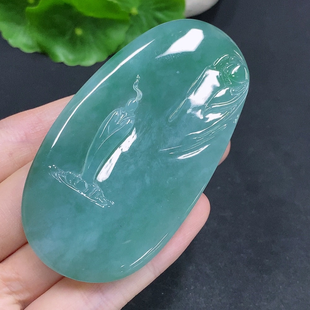 Jadeite Guanyin pendant with a formless design, crafted from jade, displayed on a plain background.