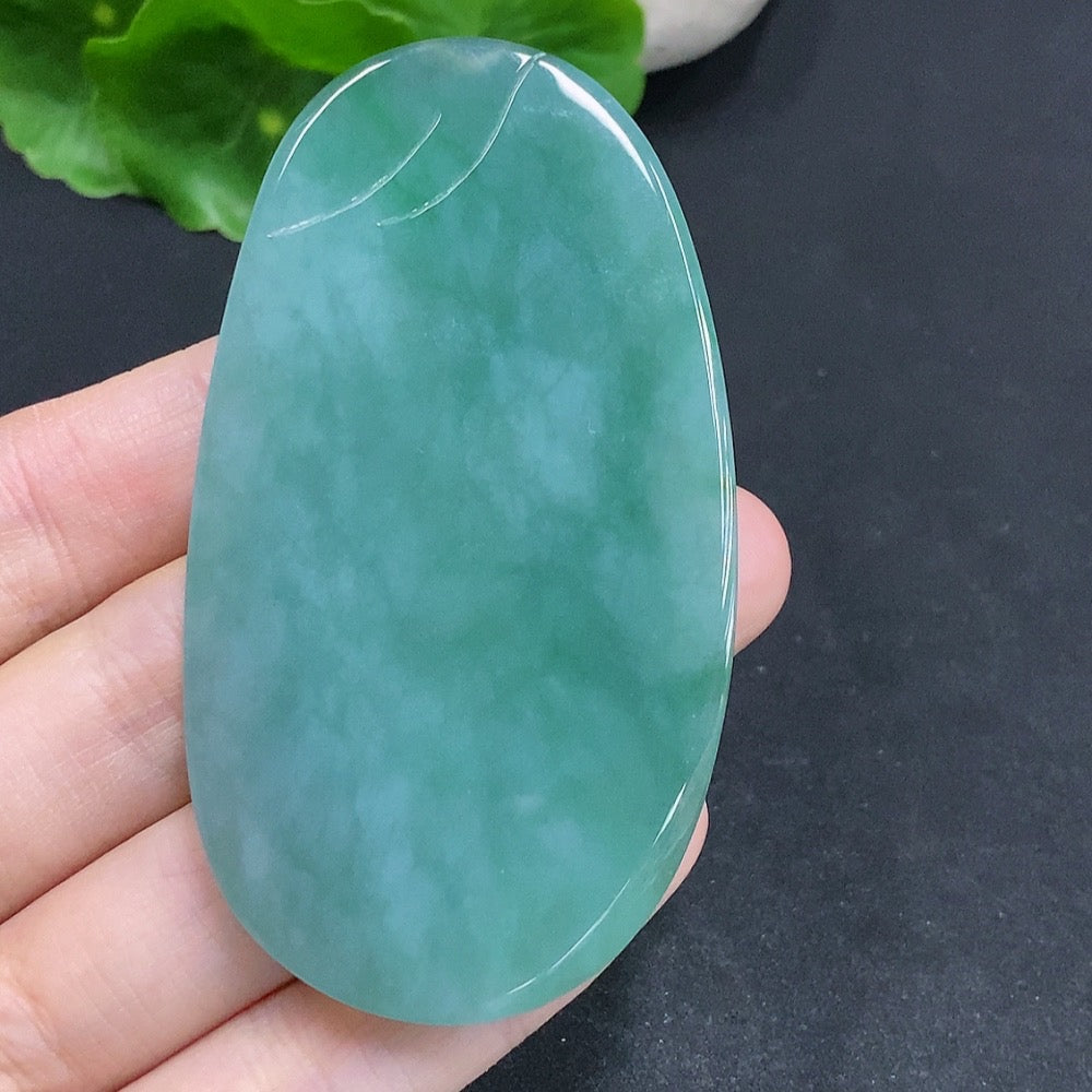 Jadeite Guanyin pendant with a formless design, crafted from jade, featuring intricate carved details, by HUILIU HQ.