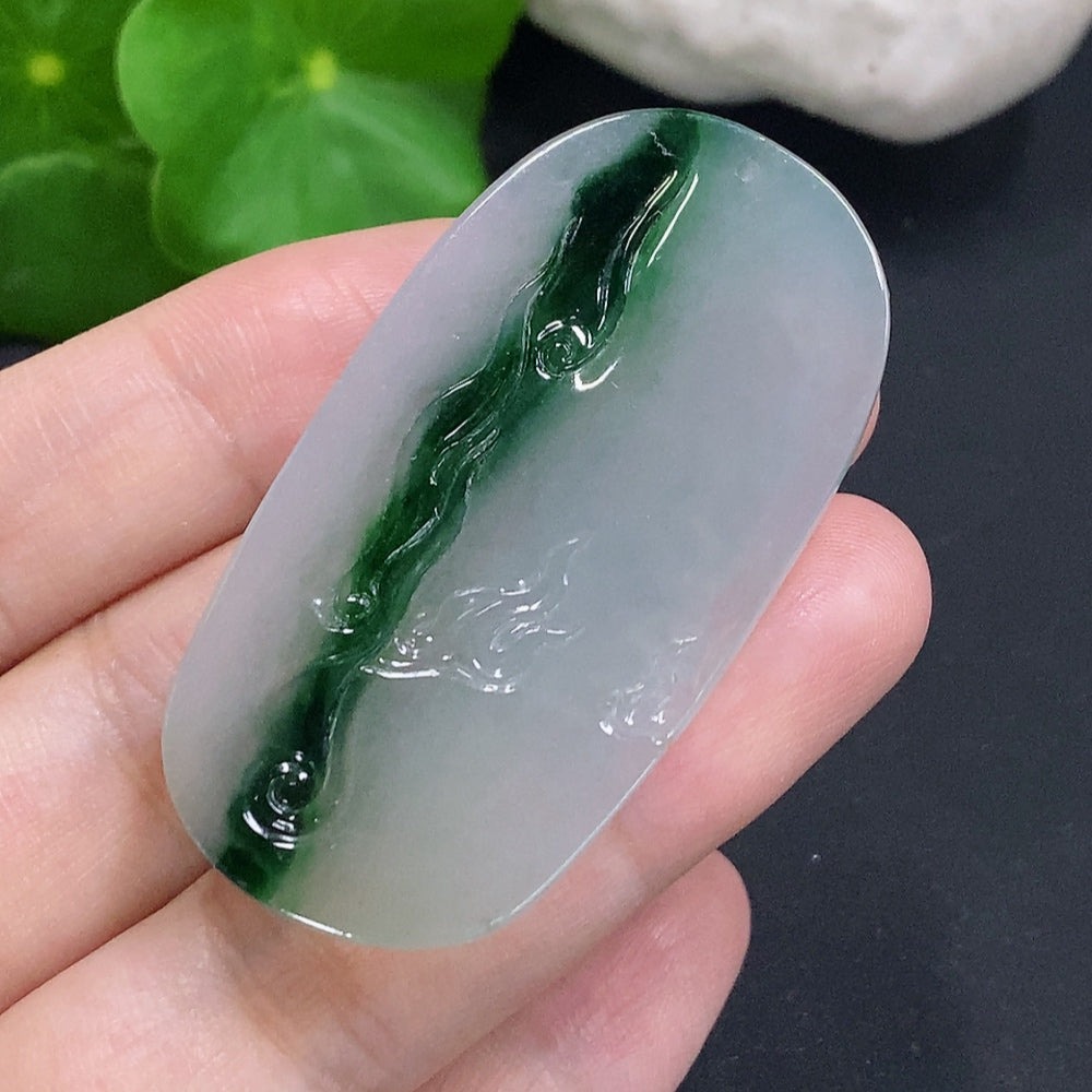 Jadeite Guan Gong pendant from HUILIU HQ featuring a carved jade figure with intricate detailing on a string.