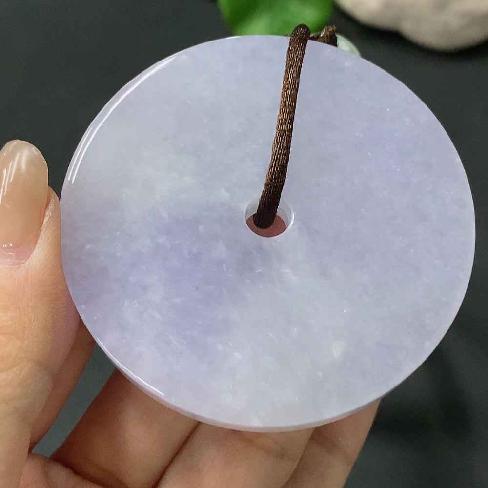 Huiliu HQ jadeite handheld piece with flat buckle, showcasing smooth green jade surface and detailed craftsmanship.