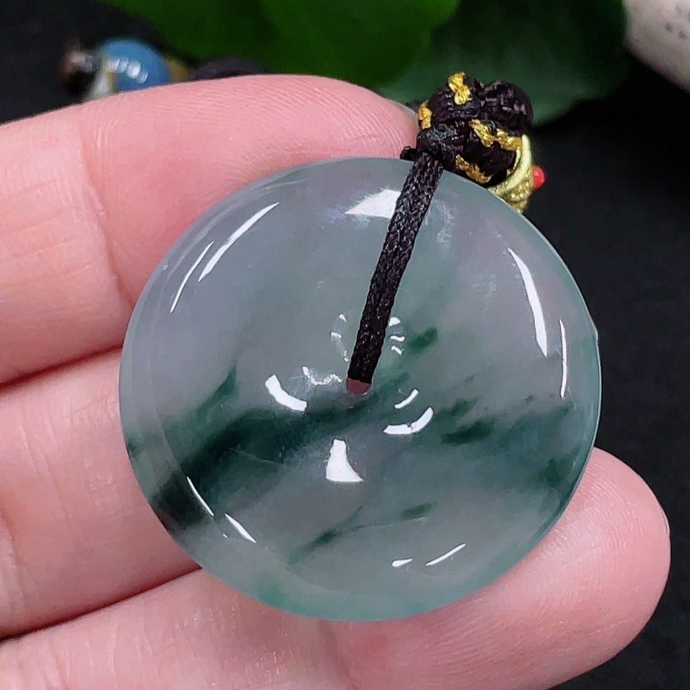 HUILIU HQ jadeite Peace buckle pendant featuring a smooth, polished green jadeite jade with carved peace symbol design.