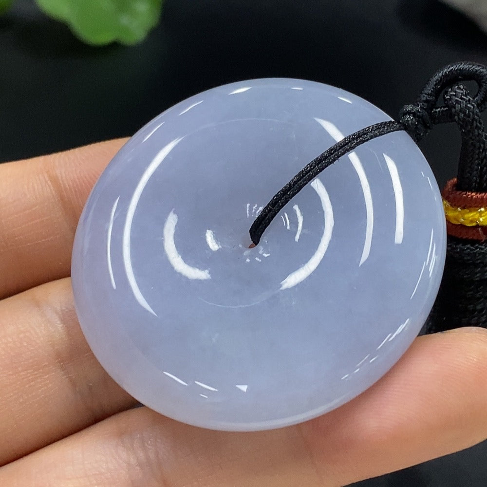 HUILIU HQ jadeite peace knot pendant featuring a smooth, polished jade pendant with intricate knot design on a silk cord.