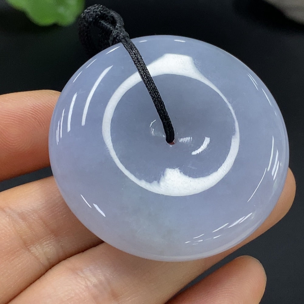 HUILIU HQ Jadeite Peace Knot Pendant, smooth green jade necklace with intricate knot design, close-up view showing polished surface.
