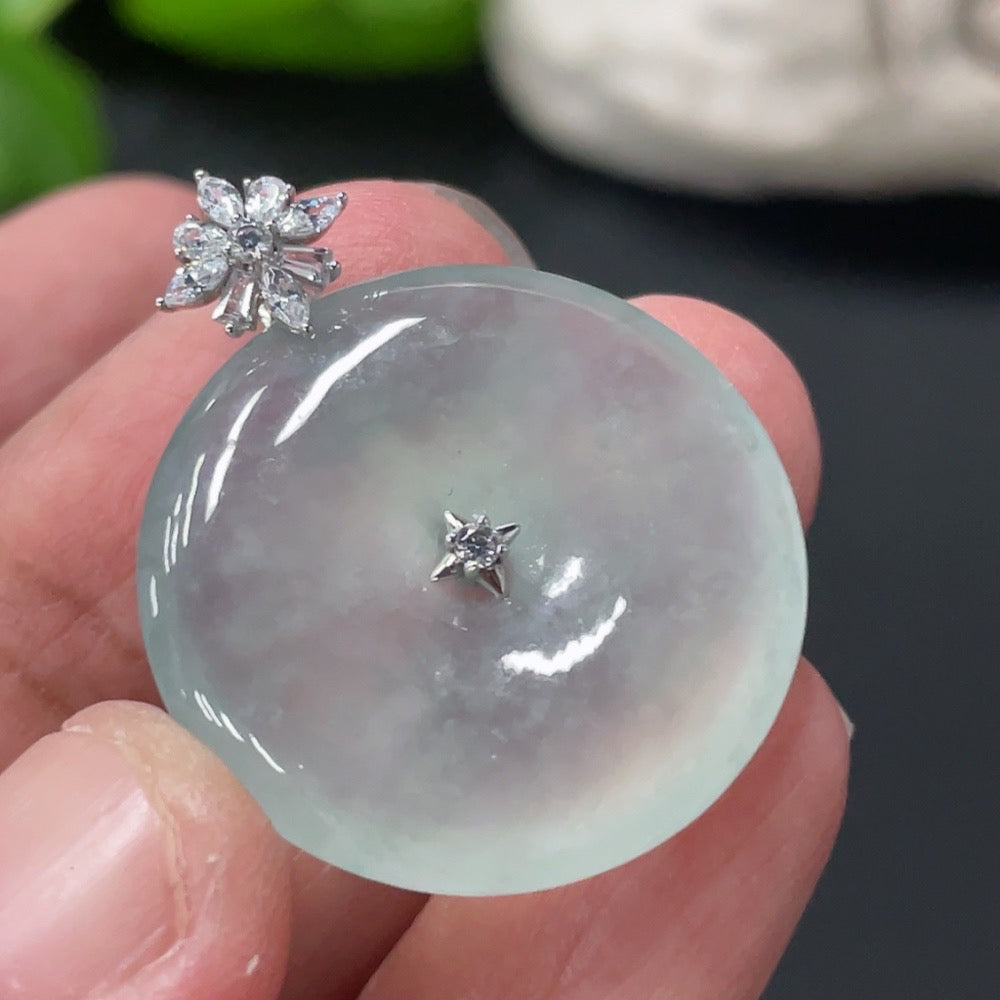 HUILIU HQ Jadeite Peace Knot Pendant made of smooth jade with intricate knot design, hanging on a delicate cord.